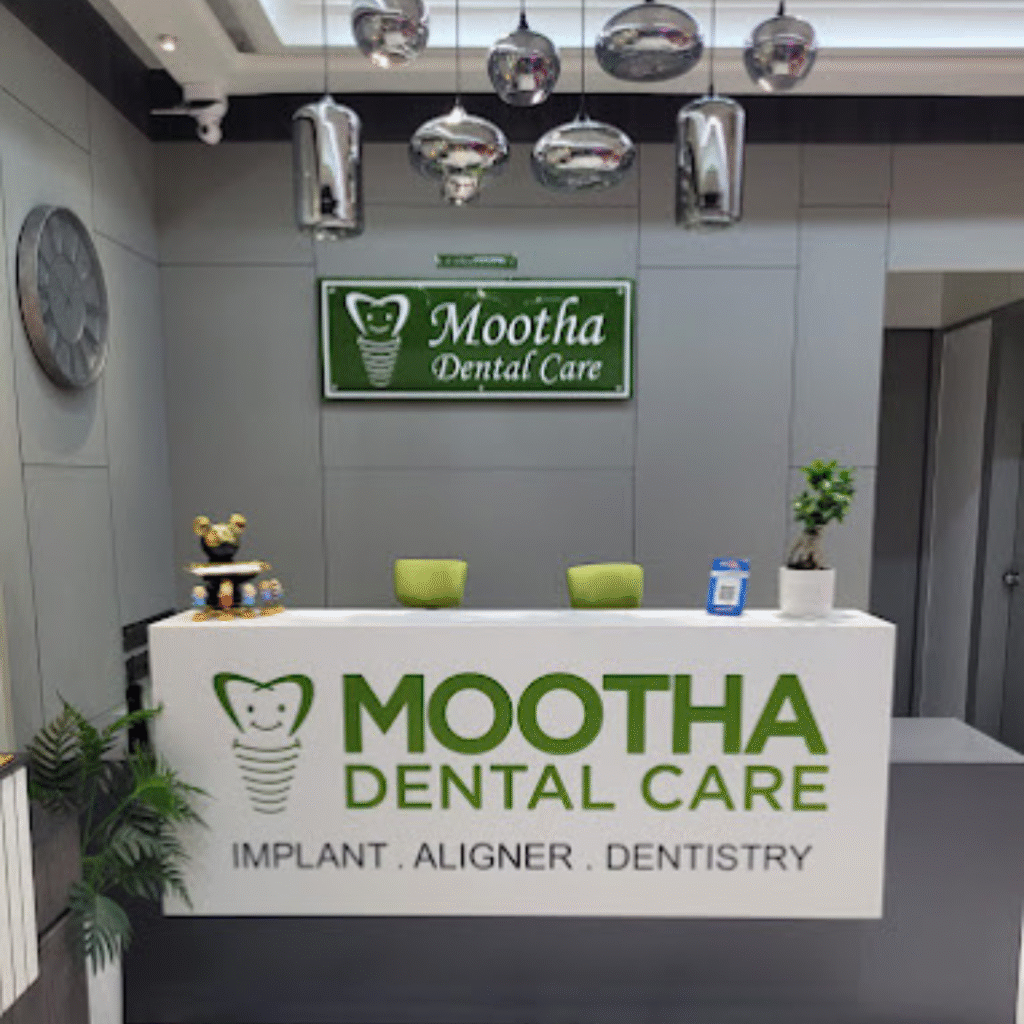 Mootha Dental Care Reception Desk with Mootha Dental Care written on it