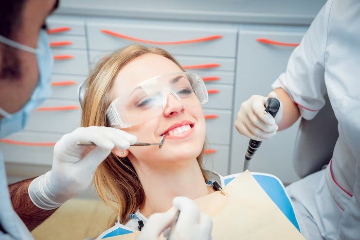 Young woman at the dental clinic for scaling and polishing